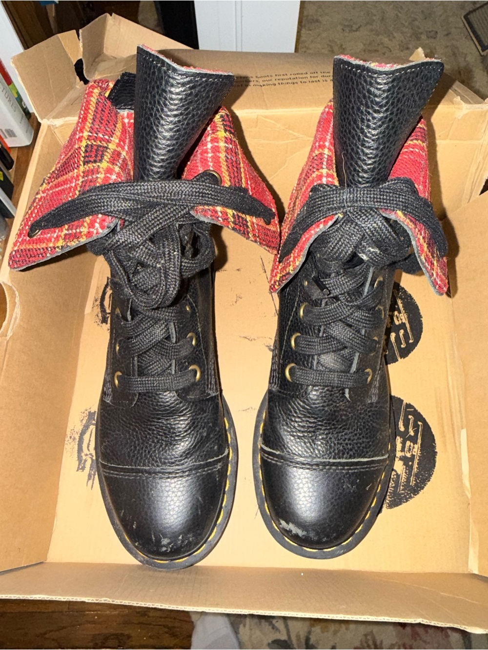 Dr. Martens Black Leather Lace-Up Boots with Red Plaid Fold-Over Cuff